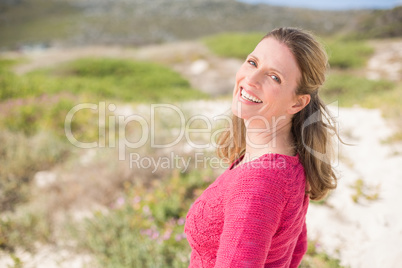 Smiling woman wearing a lovely pink top