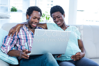 Couple looking at laptop