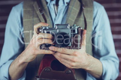 Photogrpaher holding camera