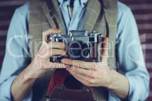 Photogrpaher holding camera