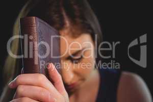 Woman praying with her bible