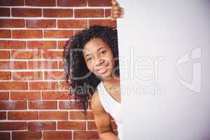 Smiling woman holding white board