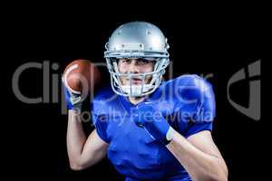 Portrait of sportsman smiling while throwing ball