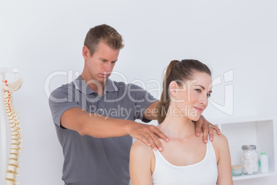 Doctor examining his patient neck