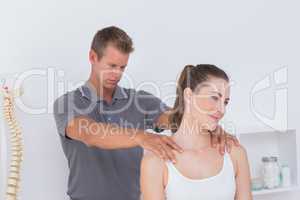 Doctor examining his patient neck