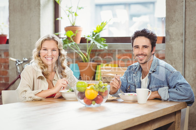 Portrait of happy creative business people during coffee break