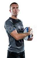 Confident rugby player in holding ball
