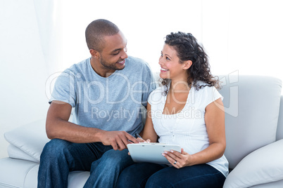 Cheerful young couple with clipboard