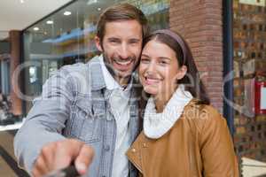 Young happy couple taking a selfie