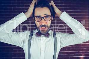 Portrait of worried man with head in hands