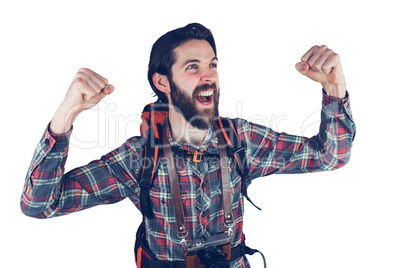 Excited hiker with arms raised