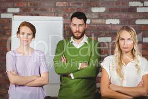 Portrait of serious business colleagues standing in office