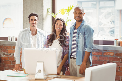 Smiling business people standing in office