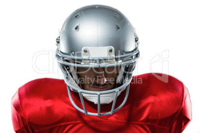 Close-up of serious American football player in red jersey looki
