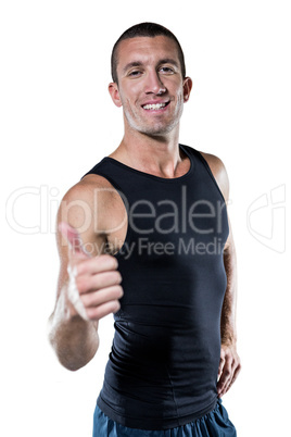 Happy athlete showing thumbs up