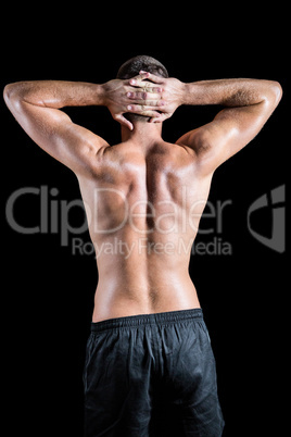 Rear view of shirtless muscular crossfiter