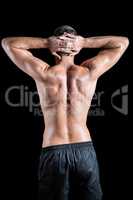 Rear view of shirtless muscular crossfiter