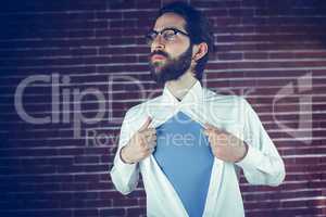 Thoughtful man opening shirt in superhero style