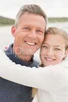 Father and daughter standing together