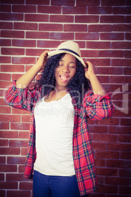 Hipster posing with a hat