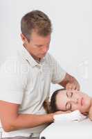 Woman receiving neck massage