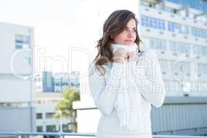 Pretty woman with warm clothes looking away
