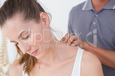 Doctor doing neck adjustment