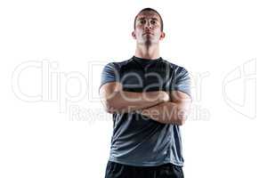 Confident rugby player with arms crossed