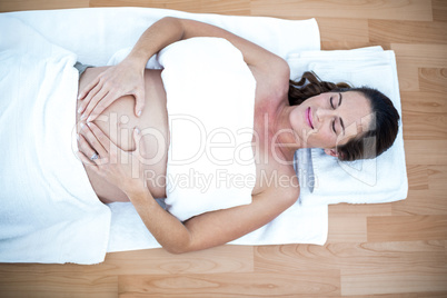 Pregnant woman relaxing at home