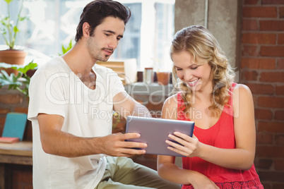 Man and woman looking at digital tablet