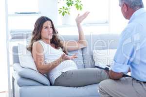 Pregnant woman talking with psychiatrist