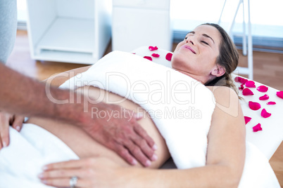 Pregnant woman receiving massage