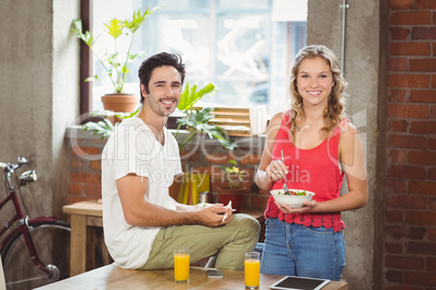 Portrait of smiling business people in bright ofice