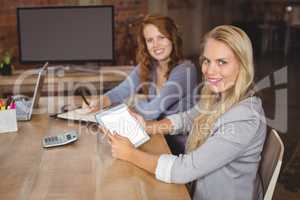 Portrait of smiling business colleagues posing