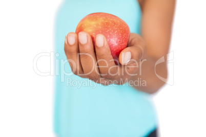 Model holding a red apple