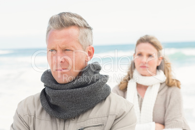 Upset couple look away from each other