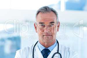 Portrait of male doctor standing at hospital