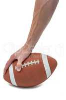 American football player placing the ball