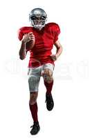 Full length of American football player in red jersey running