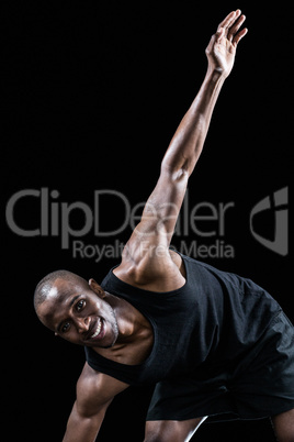 Portrait of sportsman smiling while exercising