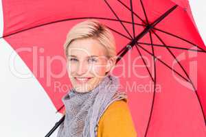 Smiling woman holding an umbrella