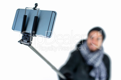 Bearded man using a selfie stick