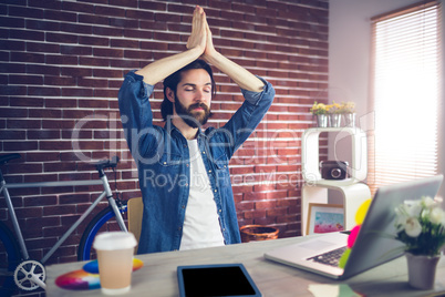 Businessman with eyes closed meditating