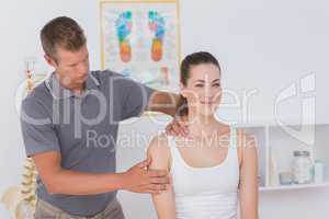 Doctor stretching woman arm