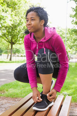Hipster tying her shoelace