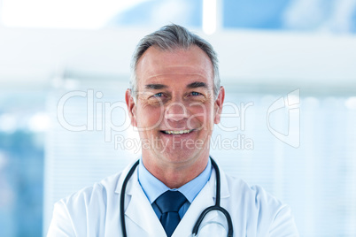 Portrait of smiling male doctor in hospital