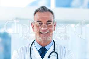 Portrait of smiling male doctor in hospital