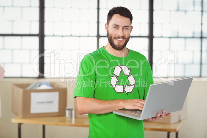 Portrait of man working on laptop in office