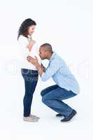 Man kissing pregnant belly against white background