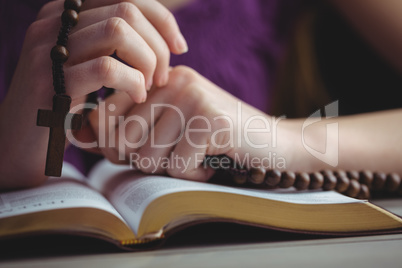 Woman praying with her bible
